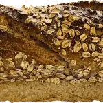 a loaf of bread with oats on it